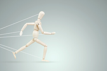 The neon marionette tied over the legs and arms fights and resists. Business difficulty or struggle with career obstacle concept, bureaucracy