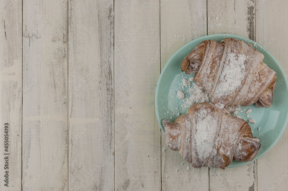 Wall mural Croissant on plate in the restaurant