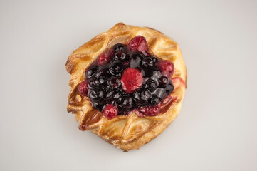 danish pastry with fruits on white background