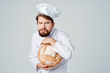 bearded man chef with bread in hand isolated background