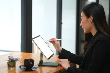 Portrait with woman using digital tablet and stylus pen, empty screen of tablet.