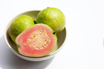Fresh pink guava on white background.