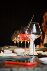 
Glasses with wine and cocktails on the festive table