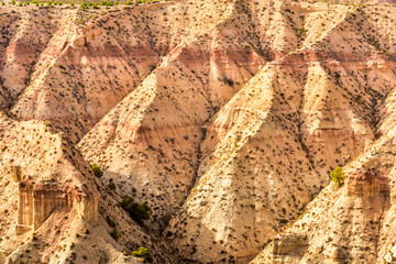 Striped hill formation in the Badlands of Gorafe desert, Andalucia, Spain - obrazy, fototapety, plakaty