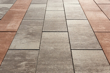 Obraz premium Visual zoning of space using paving with tiles of different colors. Selective focusing.