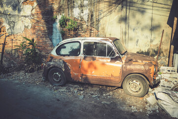 fiat old vintage classic car brown sepia tone old concrete broken brick background timeless