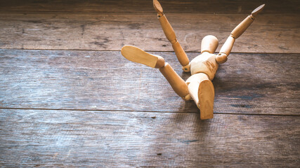 Wooden mannequin falling down. Fall concept.business.life.failure idea backgrou