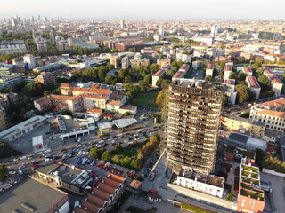 Milan, Italy - September 2, 2021: street view of the burned skyscraper Torre dei moro in Milan,...