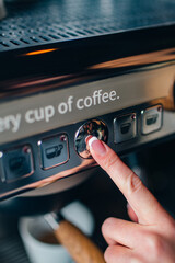 person making coffee on machine, button push, morning