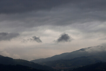 Fototapeta na wymiar Cloudy sky over the mountains in Basque Country