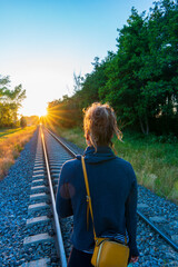 The train tracks and the sun's rays are falling beautifully.