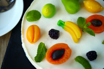 Delicious cream cheesecake with fruits. Healthy summer dessert.  White fruit cake.