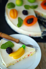 Delicious cream cheesecake with fruits. Healthy summer dessert.  White fruit cake.