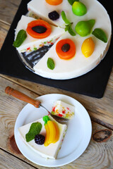 Delicious cream cheesecake with fruits. Healthy summer dessert.  White fruit cake.