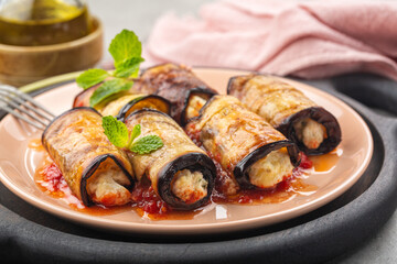Eggplant roll ups with ricotta, parmesan cheese and tomato sauce.