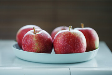 Apples on plate, red and green apples