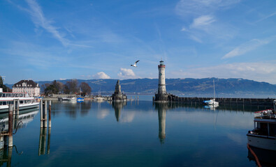 Fototapeta na wymiar the beautiful harbour of Lindau island on lake Constance in Germany on a sunny day in March