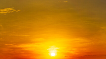 sunrise on orange sky and faint clouds, natural scenery