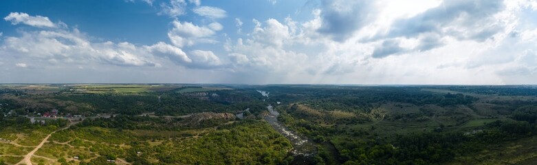 Fototapeta na wymiar Landscape of the river and granite rocks aerial panorama view. Radon Lake in Migiya Ukraine