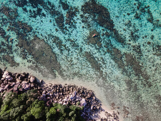 Aerial drone view of kayak in crystal clear sea water
