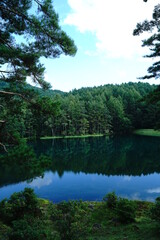 Fototapeta premium A scenic pond in the mountains at an altitude of 1,500 m in Nagano Japan.