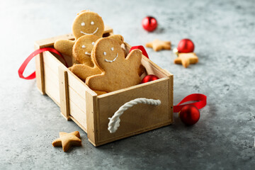 Traditional festive gingerbread men in a wooden box