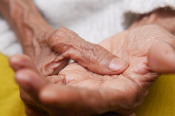 Fototapeta premium Elderly woman suffering from pain in hand 