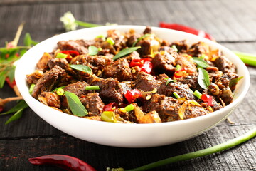 Homemade meat fry with spices, traditional Indian recipes.