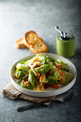 Traditional homemade Caesar salad with salmon