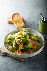 Traditional homemade Caesar salad with salmon