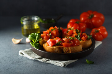 Traditional homemade bruschetta with tomato and basil