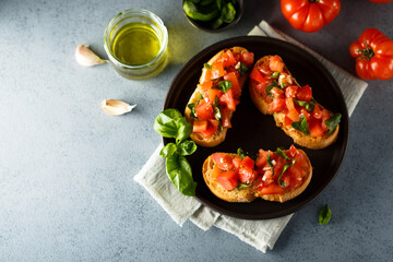 Traditional homemade bruschetta with tomato and basil