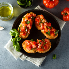 Traditional homemade bruschetta with tomato and basil