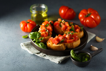 Traditional homemade bruschetta with tomato and basil