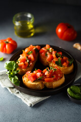 Traditional homemade bruschetta with tomato and basil