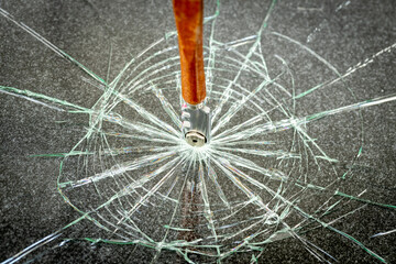 broken safety glass and a vertical glass cutter