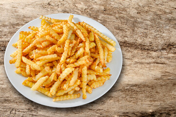 Hot French fries on white plate.