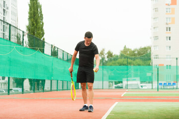 Fototapeta na wymiar Tennis player getting ready to start playing on the tennis court.