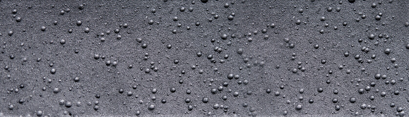 Porous texture with round holes. Raindrops on glass.