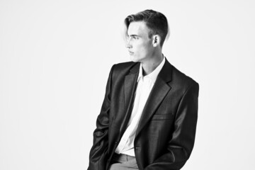 handsome man fashionable hairstyle in suits posing close-up