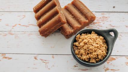 panela, from sugar cane, for different preparations on a white wooden base, made in Colombia.