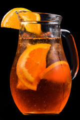 Aperol spritz cocktail in a glass pitcher isolated