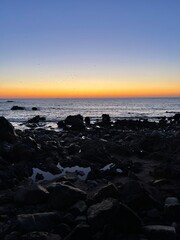 Sunset, rocks and sea breeze