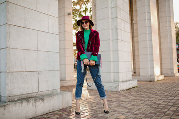 attractive woman in autumn style trendy outfit walking in street