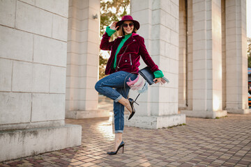 attractive woman in autumn style trendy outfit walking in street