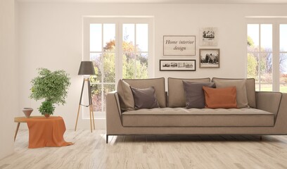 Fototapeta premium Stylish room in white color with sofa and autumn landscape in window. Scandinavian interior design. 3D illustration