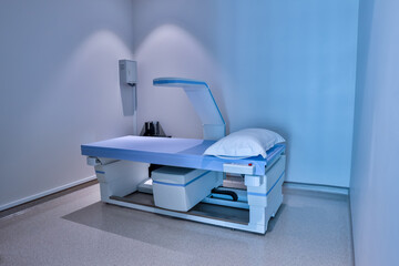 Equipment X-ray equipment in modern hospital. Modern x-ray machine and Computerized Axial Tomography scanning in hospital. X-ray room in a hospital operating room with a classic ceiling-mounted x-ray