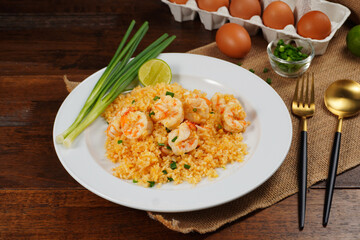 Shrimp fried rice and homemade food egg on a white plate