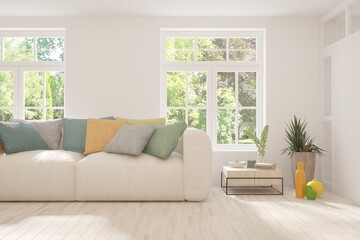 Fototapeta premium Stylish room in white color with sofa and summer landscape in window. Scandinavian interior design. 3D illustration