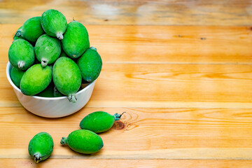 Feijoa fruit photo. Healthy diet, citrus fruit sign.